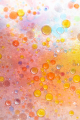 Planet Looking Bubbles of Coloured Water on Oil Fantasy Background