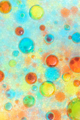 Planet Looking Bubbles of Coloured Water on Oil Fantasy Background
