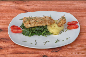 Fish hake spinach potatoes cherry red