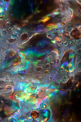 Planet Looking Bubbles of Coloured Water on Oil Fantasy Background
