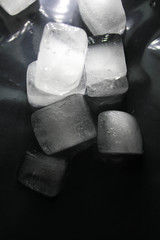 Ice cubes on a black background