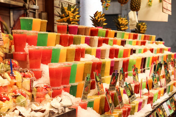 Colourful stand of fresh smoothies