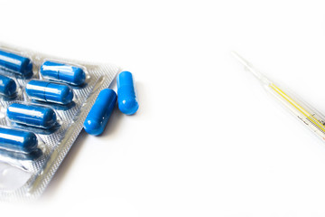 Medicine in capsules on a white background