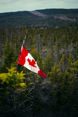 Canada flag  on the top of mountain