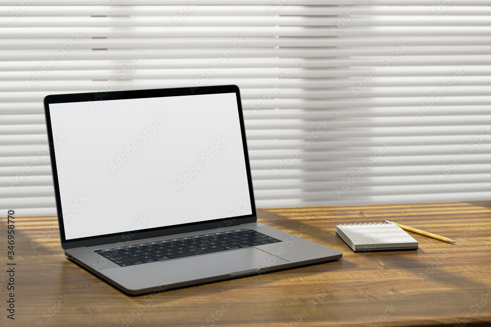 Wall mural laptop computer on a wooden surface with notebook and pencil