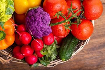 Vegetables in a wicker basket. Harvest