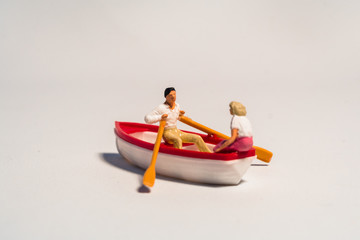 miniature figure of kayaking, rowing the boat