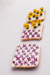 3 sandwiches with yellow and pink flowers