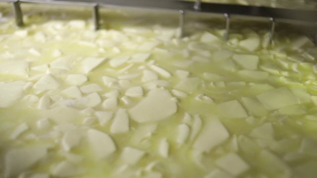 butter being churned in an industrial mixer
