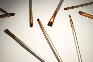 Makeup brushes on a white background