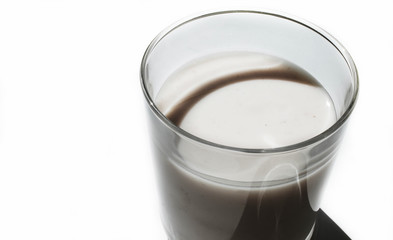 Yogurt in a glass on a white background