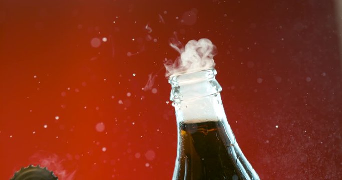 Opening glass bottle in slow motion. Fizz and bubbles. Phantom 4k camera