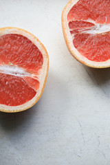 Sliced grapefruit on a light background
