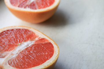 Sliced grapefruit on a light background