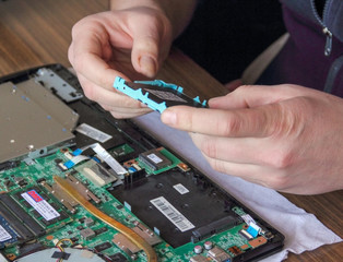 KRAGUJEVAC, SERBIJA February 01.2020:  In man hands holding a new SSD external disk drive,ready to install in laptop