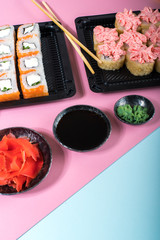 Philadelphia and lava rolls in a black boxes with chopsticks. Food delivery