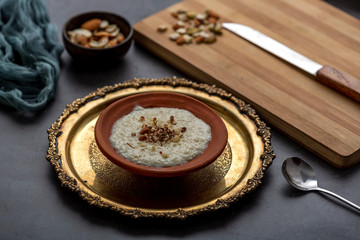 Phirni, a traditional and delicious indian style milk and rice based creamy dessert, served in clay pot