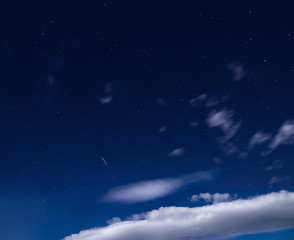 Fototapeta premium Vast starry sky with clouds