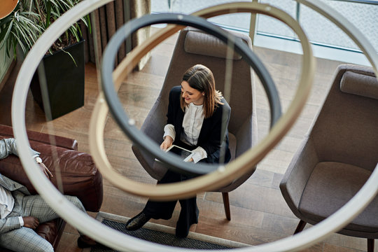 Businesswoman in a meeting in hotel lobby