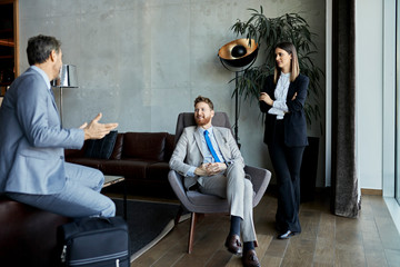 Business people having a meeting in hotel lobby