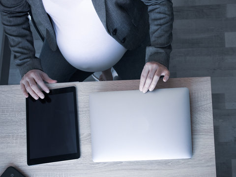 Pregnant working in office