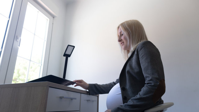 pregnant working in an office