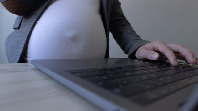 Pregnant working in office