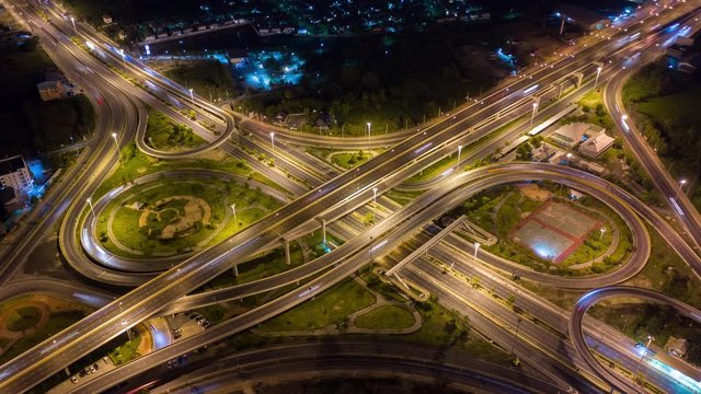 Time lapse Aerial view and top view of traffic on city streets in Bangkok , Thailand. Expressway with car lots. Beautiful roundabout road in the city center.