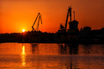 Fototapeta na wymiar Sunset over the port