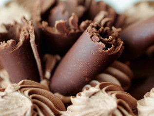 Black chocolate cream cake close up background