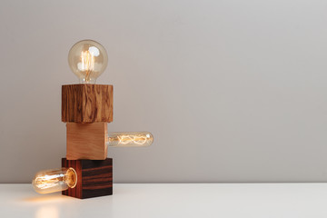 Unique old-fashioned steampunk style lamps on variety of wooden bases