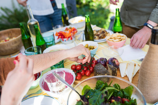 Close-up of friends enjoying healthy lunch outdoors