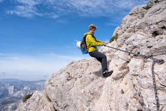 Woman mountaineering at Bernia Ridge, Costa Blanca,  Alicante, Spain