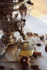 Tula samovar with tea, bagels and flowers