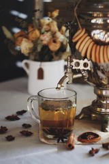 Tula samovar with tea, bagels and flowers
