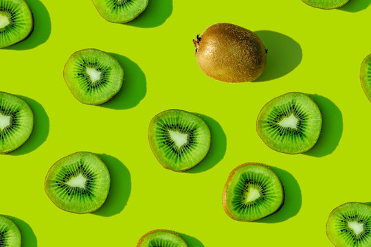 Kiwi fruit pattern on green background
