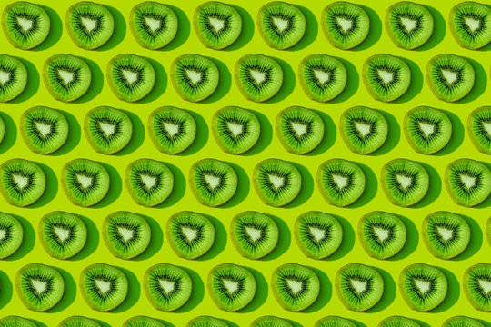 Kiwi fruit pattern on green background
