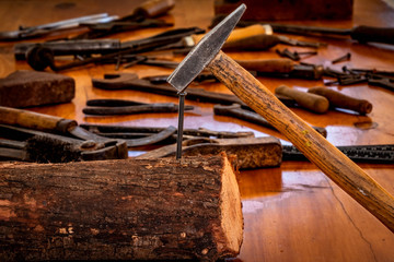 old rusty nails, hammer and other tools