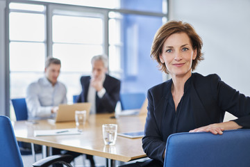 Portrait of confident businesswoman during a meeting in office