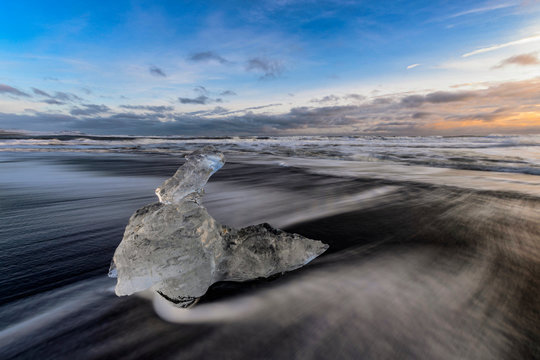 Iceland, Ice chunk lying at shore of?Jokulsarlon?at dusk