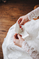 A note in the bride's hand.A card, a Valentine with a Declaration of love.Wedding, celebration,...