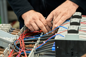Close-up of electrician working on circuitry