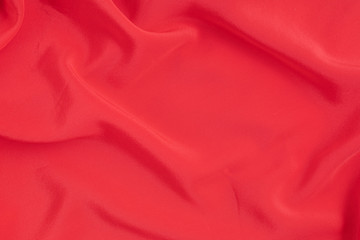 Abstract background of red silk fabric. Texture, luxury, fashion, style