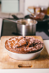 Homemade chocolate cake cooked on a domestic kitchen on a metal plate