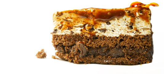 Chocolate cake, slice. Close up. Chocolate cake with a biscuit in the middle and glazed on top, Isolated on white background. With copy space. Tasty and sweet. 
