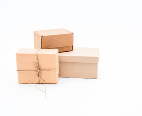 Three brown kraft boxes on white background