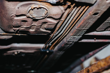 rusty brake and fuel pipes under the bottom of the car.
