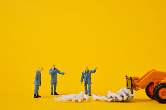 miniature figures of workers and a toy loader