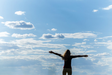 The freedom to feel good and to travel is an adventure concept. Copy space of woman silhouette...