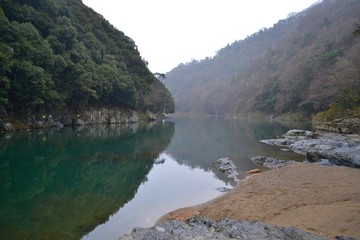 Fototapeta na wymiar Calm river in mountains of Japan